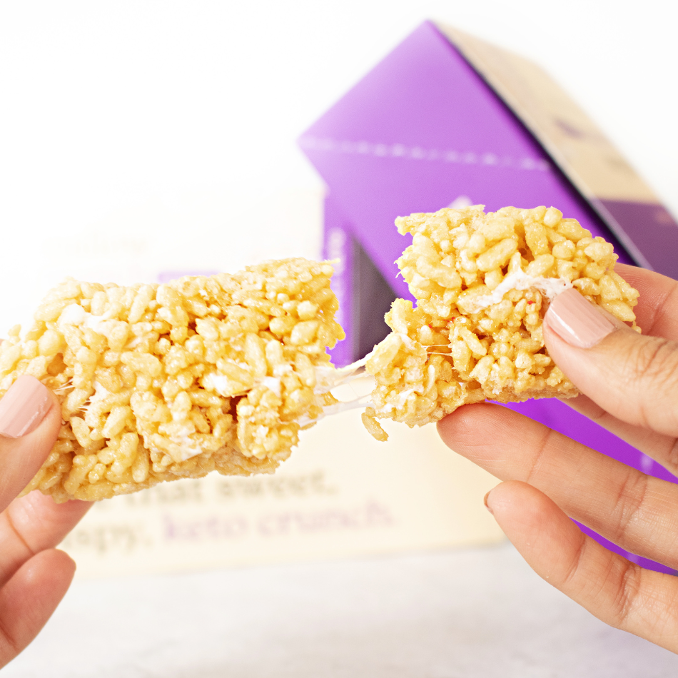 breaking a Mallow munch bar in half